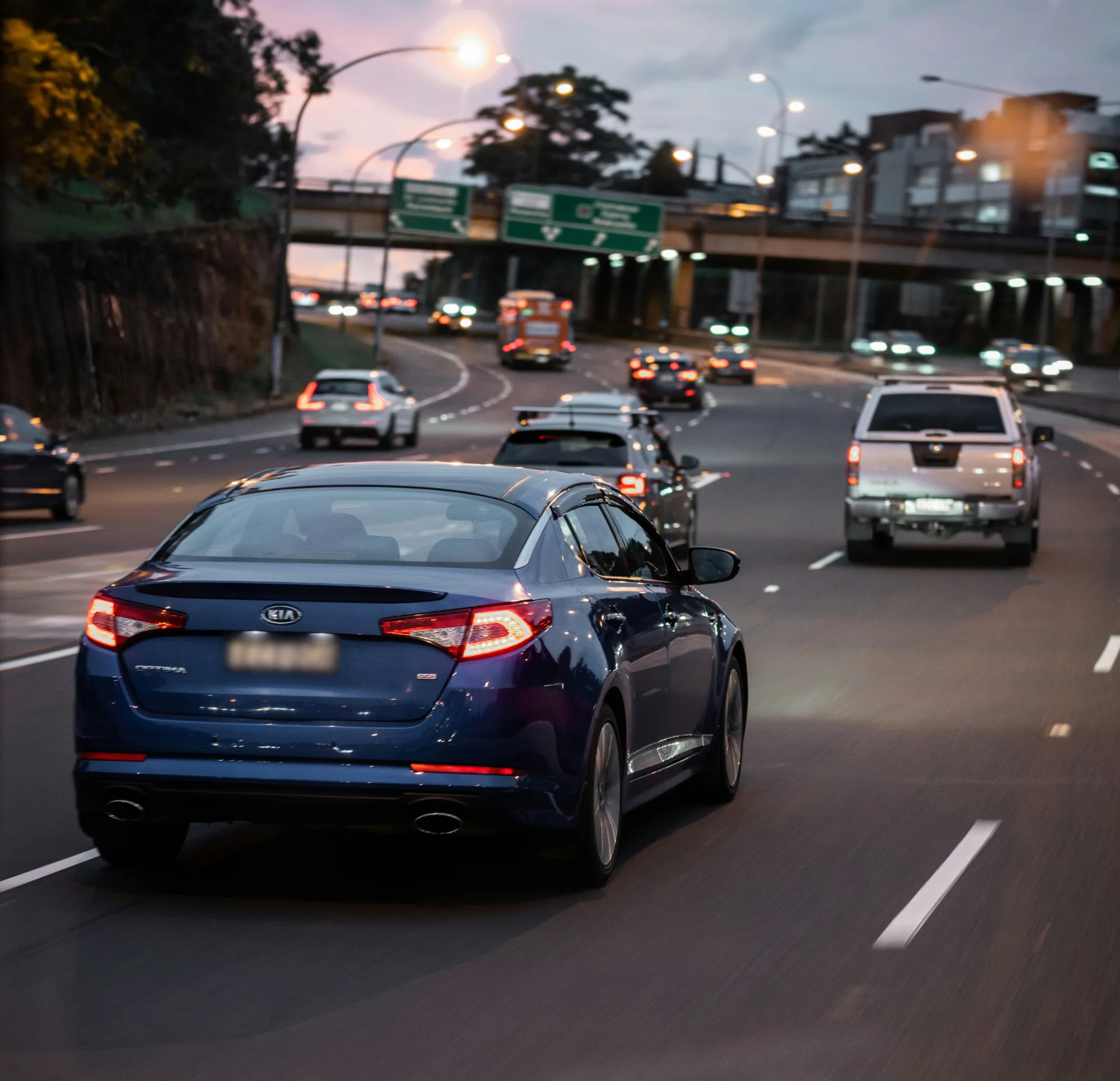 A car driving in evening highway traffic